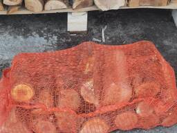Firewood in apple nets